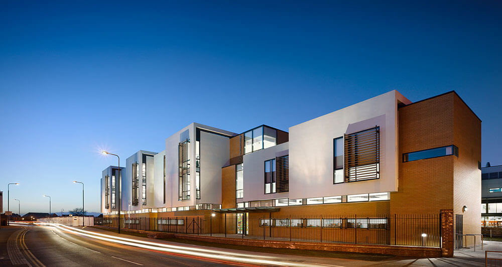 A front view of Trafford college in the early evening
