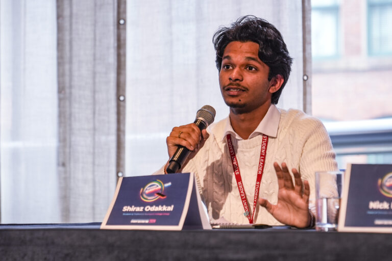 Student sat talking into microphone
