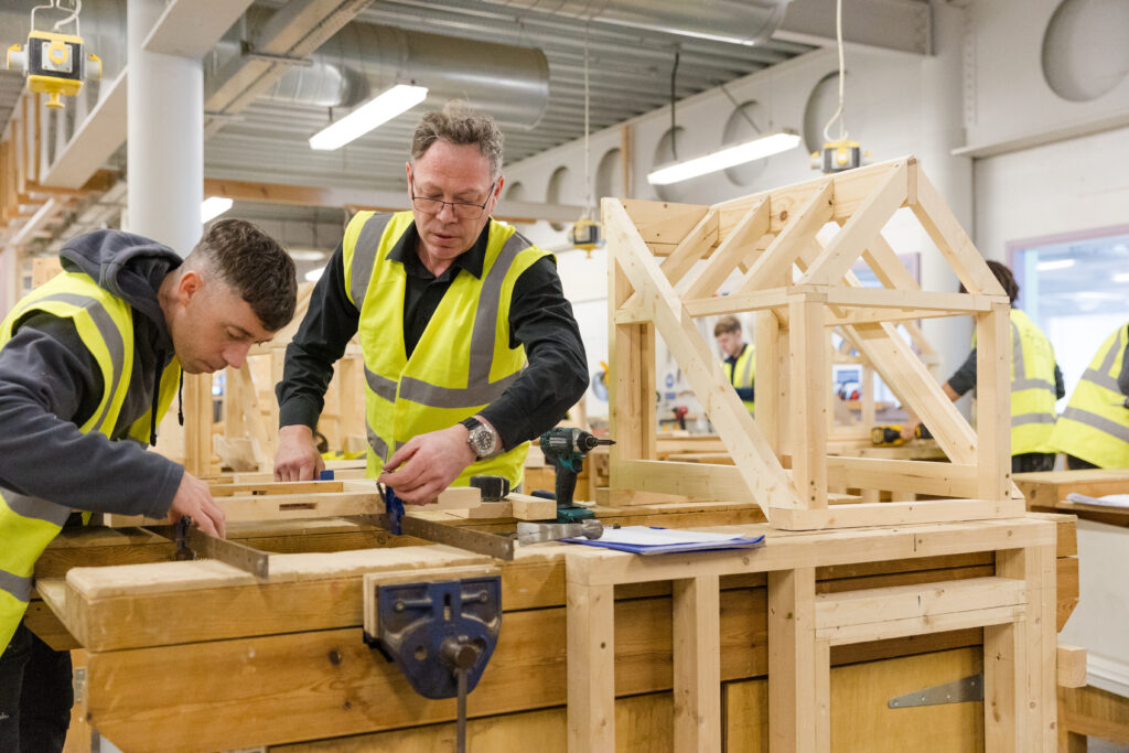carpentry tutor and students