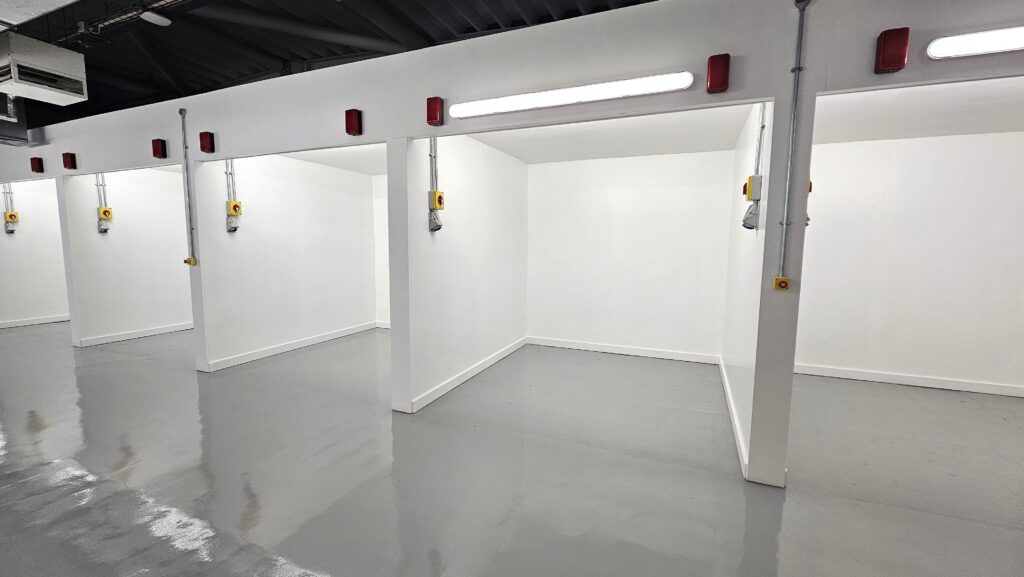 White row of training bays equipped with electrical sockets