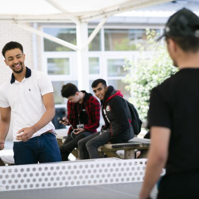 students playing table tennis